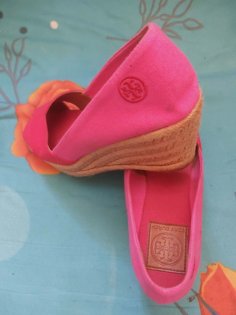 Tory Burch Pink Canvas Espadrille Wedges (Category: Wedges) located in Nabunturan. Submitted by kairosas85 (Listing ID 1466587274, Image 3). Description: - Brand: Tory Burch - Style: Open-toe espadrille wedges with crossover canvas straps - Color: Bright pink - Features: Braided jute heel wedge, textured rubber sole, embossed leather inner sole patch, and subtle tonal logo stamp on outer heel - Condition/Vibe: Vibrant summer shoes, easy to style 