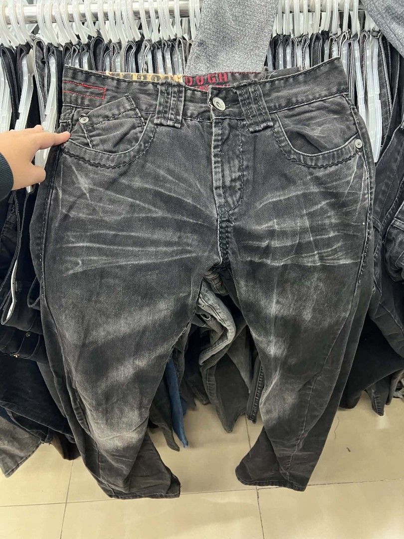 Tough Jeanssmith Black Distressed Denim Jeans (Category: Jeans) located in Urdaneta. Submitted by jayceegarage (Listing ID 1466721079, Image 1). Description: - Brand: Tough Jeanssmith - Color/Finish: Black with a heavily washed, distressed look - Fit: Straight cut, highly durable fabric - Unique Details: Metal grommet strap hanging from the back pocket and classic zig-zag stitching - Branding: Vintage 1957 tag on the waistband - Condition: Excell