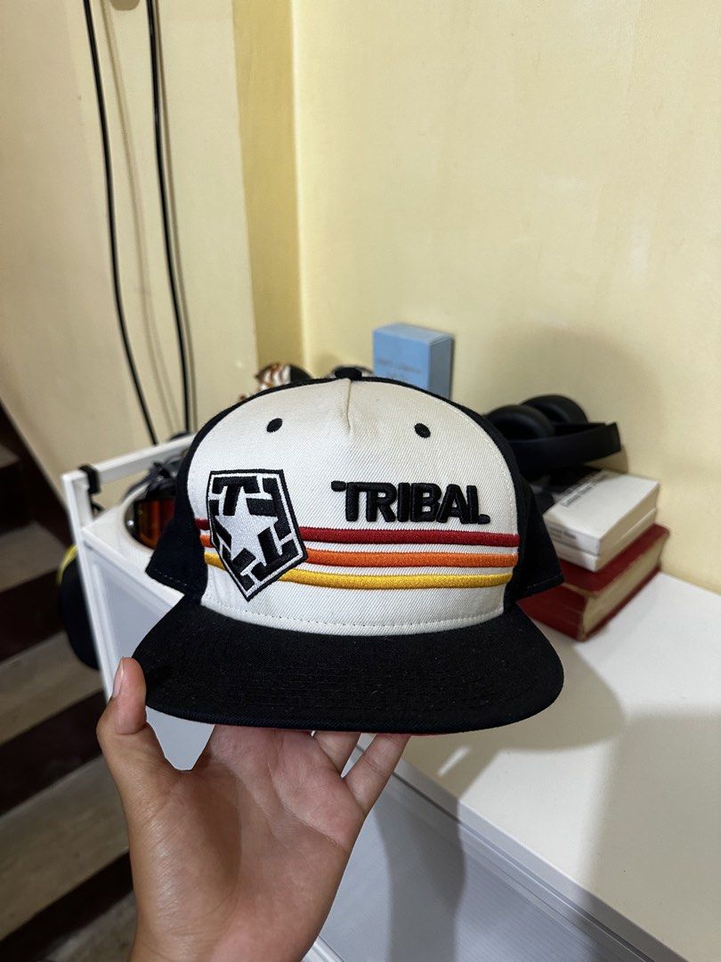 Tribal Gear Snapback Cap (Category: Caps & Hats) located in Baler. Submitted by sidequester (Listing ID 1466570472, Image 1). Description: - Brand: Tribal Gear - Style: Snapback cap (black and white front panels) - Details: Embroidered logo and text on the front - Closure: Adjustable snap back with woven Tribal logo tag - MOP: Any online bank or e-wallets - MOD: Can do meet up and ship nationwide - Can offer discount or bundle price for hats.
