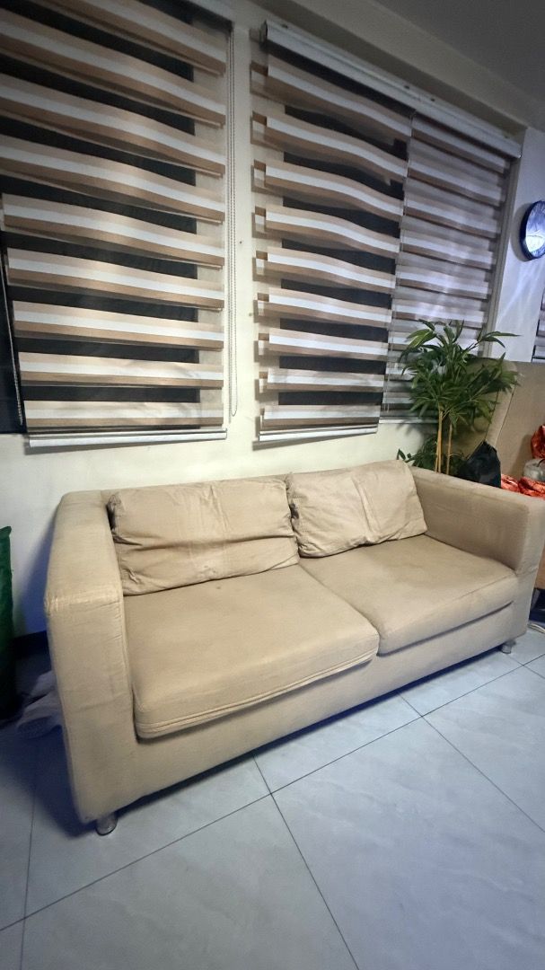 Two-Seater Sofa Beige (Category: Sofas) located in Caloocan City. Submitted by xinne87 (Listing ID 1466575769, Image 2). Description: - 2-seater fabric sofa with thick back cushions and wide armrests for ultimate comfort - Includes TWO complete slipcover sets: versatile solid beige and stylish bold red patterned - Sturdy build supported by short, modern metal legs - Ideal size for living rooms, guest rooms, or condo/apartment spaces - Easy to cle