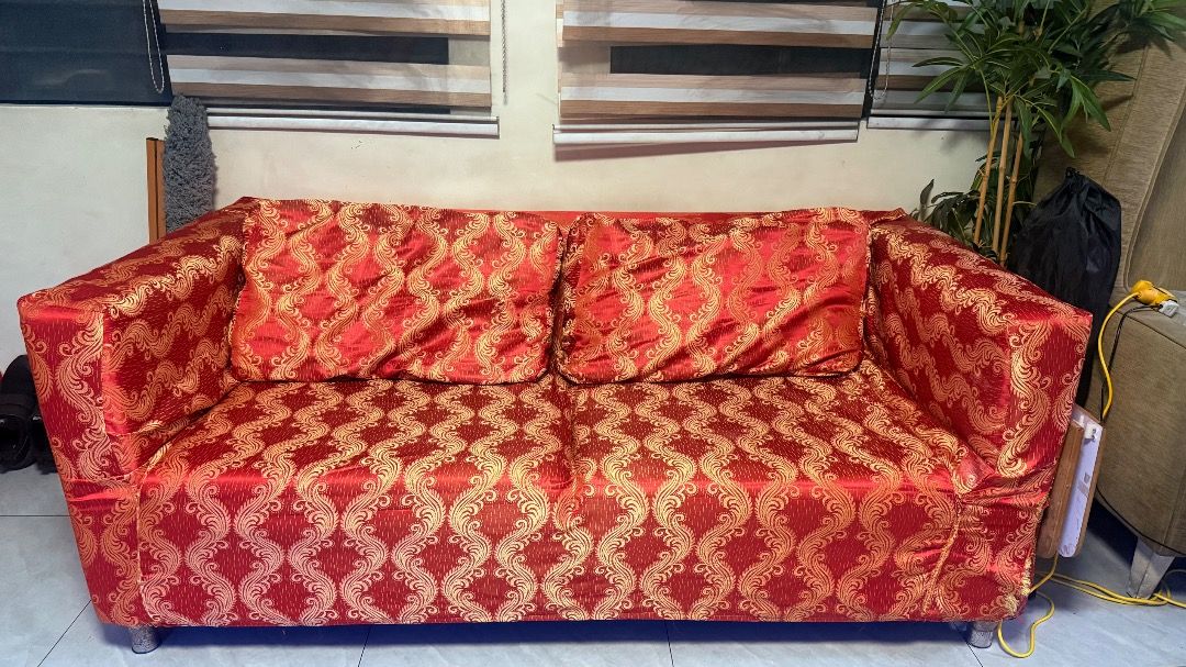 Two-Seater Sofa Beige (Category: Sofas) located in Caloocan City. Submitted by xinne87 (Listing ID 1466575769, Image 3). Description: - 2-seater fabric sofa with thick back cushions and wide armrests for ultimate comfort - Includes TWO complete slipcover sets: versatile solid beige and stylish bold red patterned - Sturdy build supported by short, modern metal legs - Ideal size for living rooms, guest rooms, or condo/apartment spaces - Easy to cle