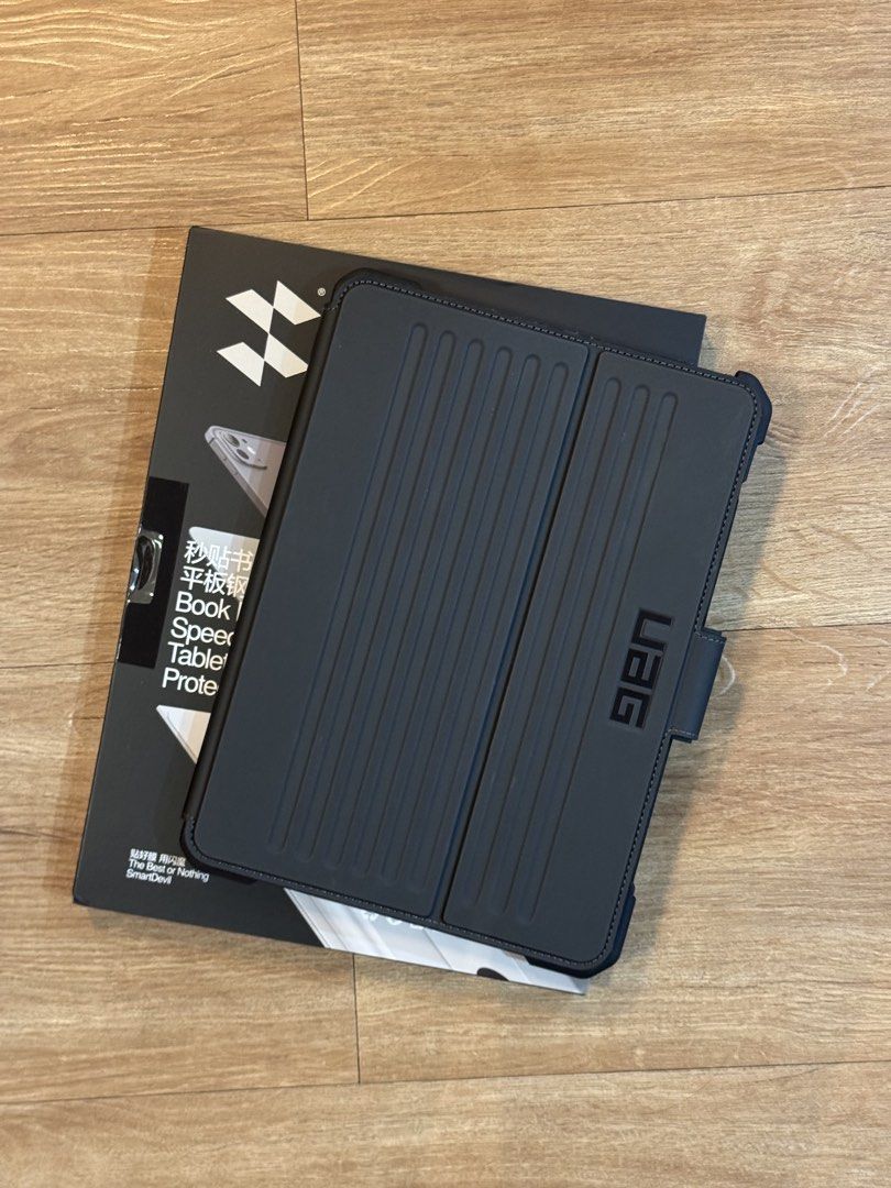UAG Case for iPad A16 / iPad 11th Gen + Sealed Screen Protector (Category: Cases & Sleeves) located in Manila. Submitted by hobbyhubsph (Listing ID 1466596907, Image 1). Description: - Compatibility: Specifically designed for iPad A16 / iPad 11th Gen - Bundle: Includes rugged UAG case plus a sealed SmartDevil screen protector - Protection: Heavy-duty shock-absorbing frame with reinforced corners - Features: Built-in Apple Pencil holder and secure