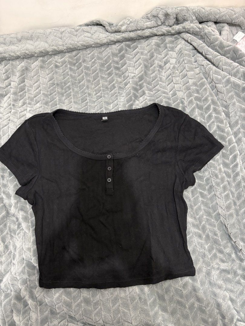 Uniqlo Black Ribbed Button-Up Crop Top (Category: Shirts) located in Manila. Submitted by joyceeipos62277 (Listing ID 1466571153, Image 1). Description: - Brand: Uniqlo - Style: Ribbed crop top with short sleeves and scoop neckline - Details: Three front buttons - Fabric: Stretchy, super comfy fit - Styling: Perfect with denim shorts or high-waisted jeans - Condition: Clean and ready to wear.