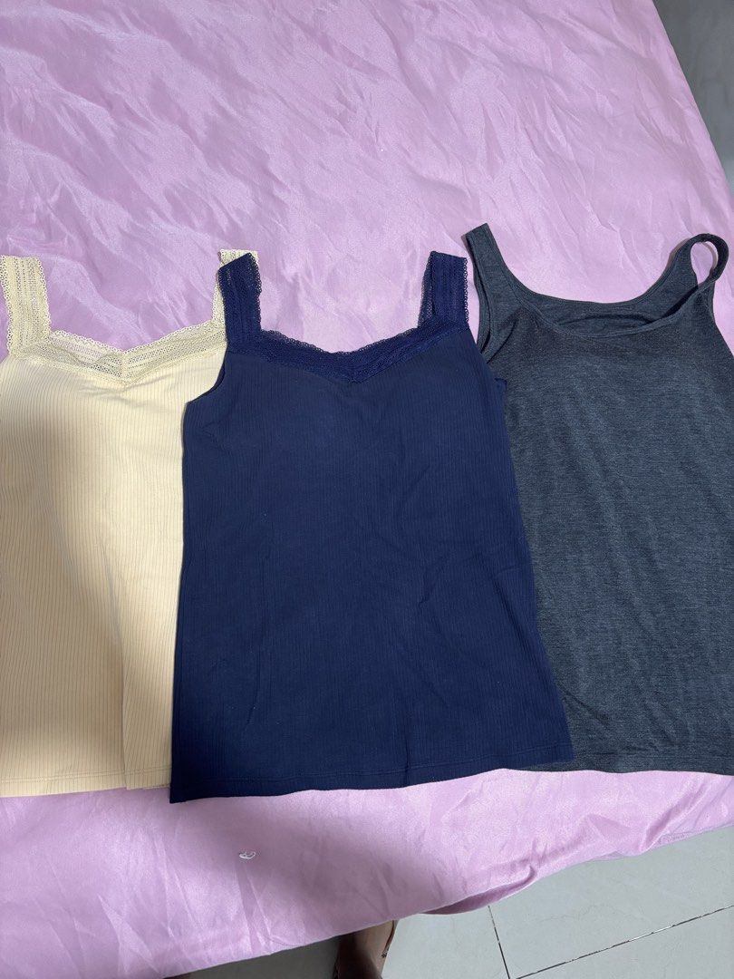 Uniqlo Camisole Tank Top Bundle (Category: Sleeveless) located in Manila. Submitted by declutterwithbeyuh (Listing ID 1466638131, Image 2). Description: - Brand: Uniqlo Airism and Heattech - Item: Bundle of 3 ribbed camisole tank tops - Colors: Dark grey, navy blue, and cream - Size: M (fits bust 80-86cm) - Condition: Good, worn a few times - Features: Stretchy fabric, super comfortable, keeps you warm, and perfect for layering TAKE ALL FOR 1k if