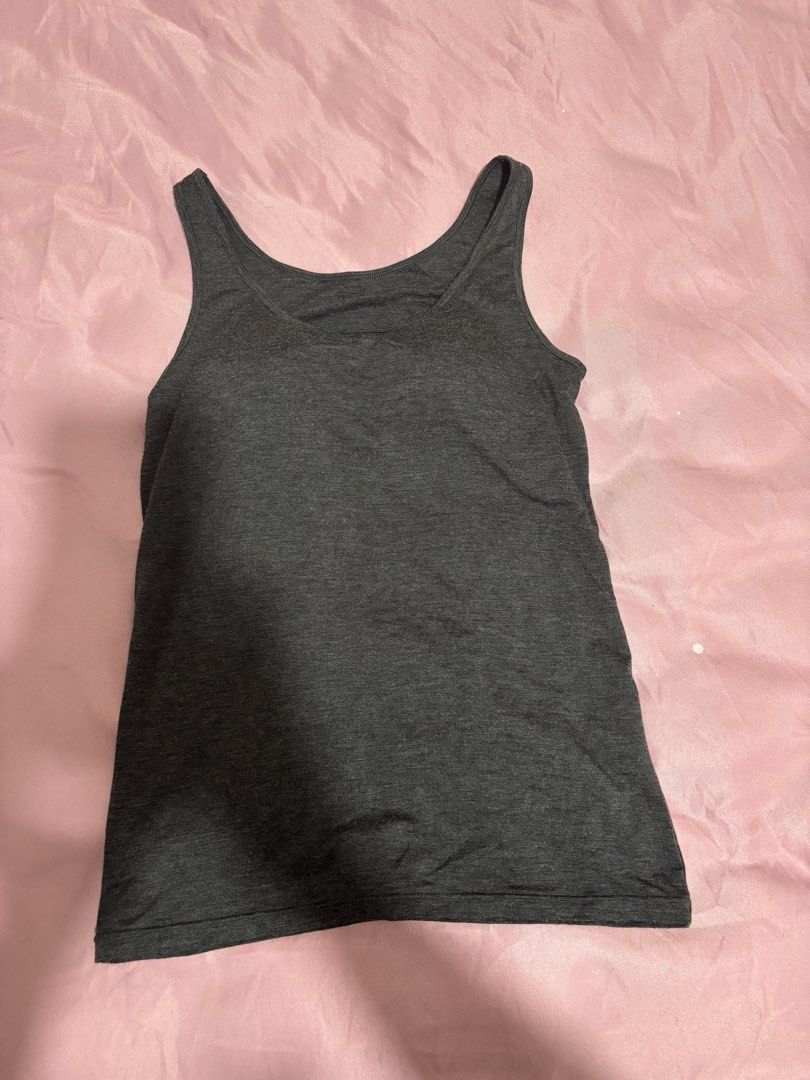 Uniqlo Camisole Tank Top Bundle (Category: Sleeveless) located in Manila. Submitted by declutterwithbeyuh (Listing ID 1466638131, Image 3). Description: - Brand: Uniqlo Airism and Heattech - Item: Bundle of 3 ribbed camisole tank tops - Colors: Dark grey, navy blue, and cream - Size: M (fits bust 80-86cm) - Condition: Good, worn a few times - Features: Stretchy fabric, super comfortable, keeps you warm, and perfect for layering TAKE ALL FOR 1k if