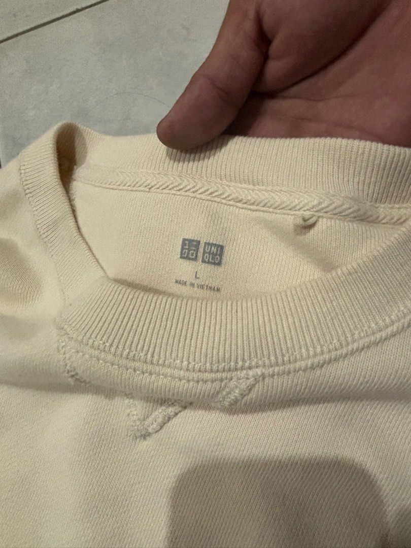 Uniqlo Cream Sweatshirt Size L (Category: Coats, Jackets and Outerwear) located in Santa Rosa. Submitted by rahbii (Listing ID 1466565246, Image 2). Description: - Brand: Uniqlo - Item: Crewneck Sweatshirt - Color: Cream / Off-white - Size: L (Tag on inner collar) - Material: Thick cotton fleece (Made in Vietnam) - Details: Classic V-stitch at the neckline, ribbed cuffs and hem - Condition: Barely worn, stored in a smoke-free wardrobe.