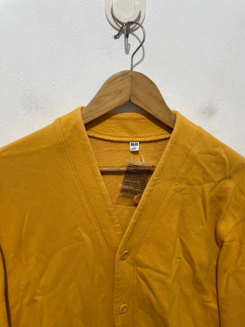 Uniqlo Mens Cardigan (Category: Coats, Jackets and Outerwear) located in Caloocan City. Submitted by alysoncala70121 (Listing ID 1466611367, Image 2). Description: - Brand: Uniqlo - Condition: Brand new with tag attached - Color: Bright mustard yellow - Style: V-neck cardigan with 5 front buttons and long sleeves - Material: 100% cotton body and pocket lining, ribbed cuffs and hem (82% cotton, 18% polyester) - Origin: Made in China.