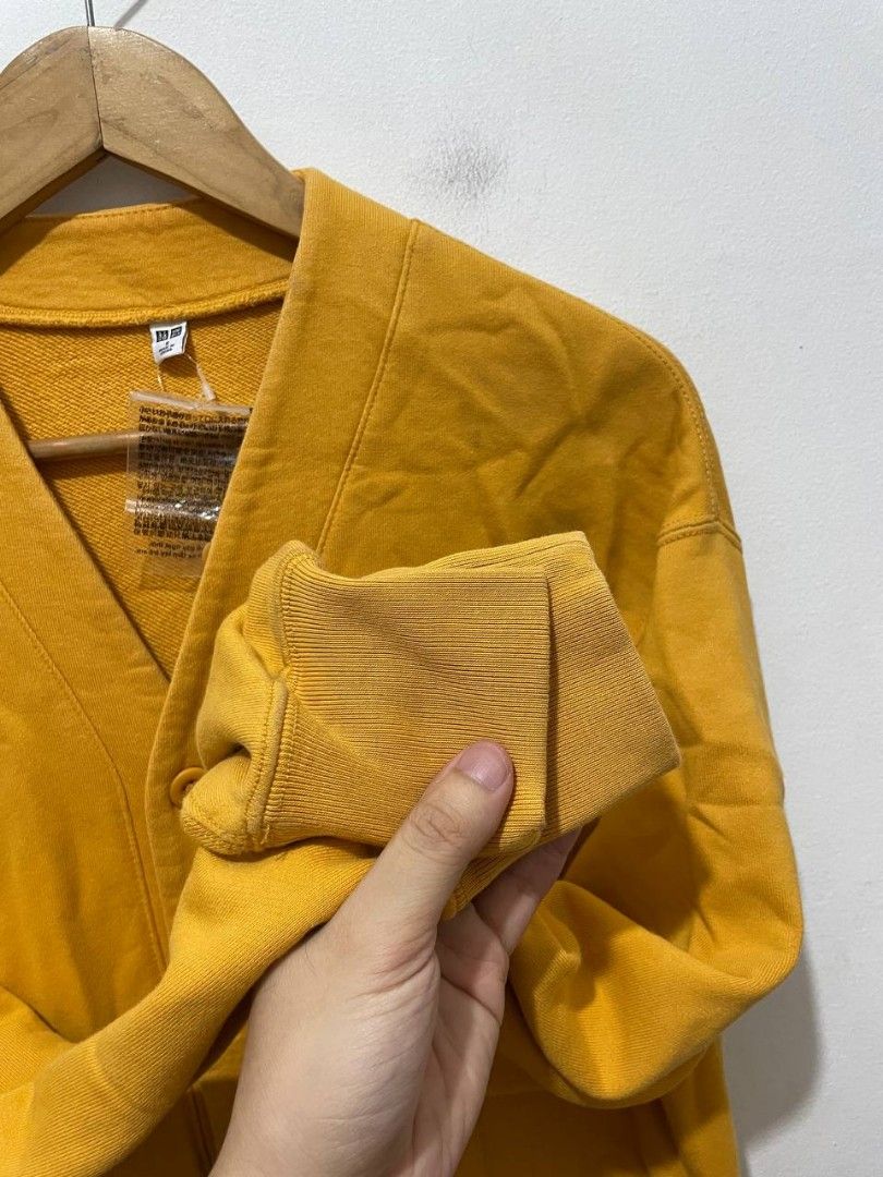 Uniqlo Mens Cardigan (Category: Coats, Jackets and Outerwear) located in Caloocan City. Submitted by alysoncala70121 (Listing ID 1466611367, Image 3). Description: - Brand: Uniqlo - Condition: Brand new with tag attached - Color: Bright mustard yellow - Style: V-neck cardigan with 5 front buttons and long sleeves - Material: 100% cotton body and pocket lining, ribbed cuffs and hem (82% cotton, 18% polyester) - Origin: Made in China.