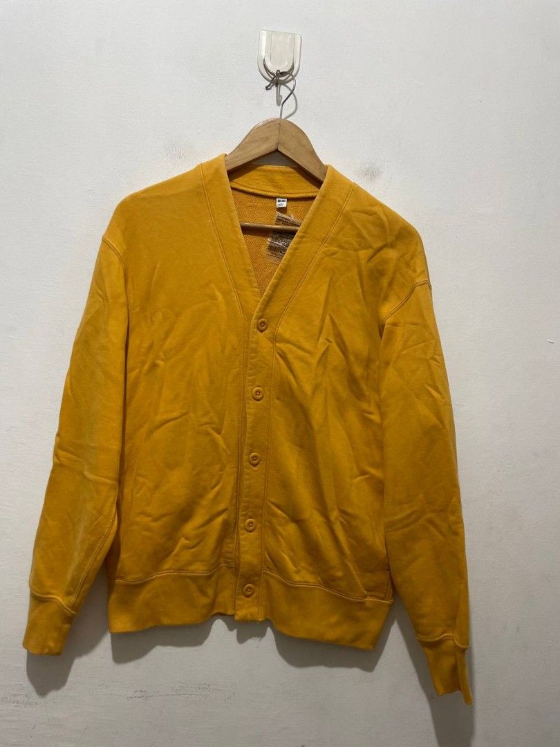 Uniqlo Mens Cardigan (Category: Coats, Jackets and Outerwear) located in Caloocan City. Submitted by alysoncala70121 (Listing ID 1466611367, Image 1). Description: - Brand: Uniqlo - Condition: Brand new with tag attached - Color: Bright mustard yellow - Style: V-neck cardigan with 5 front buttons and long sleeves - Material: 100% cotton body and pocket lining, ribbed cuffs and hem (82% cotton, 18% polyester) - Origin: Made in China.