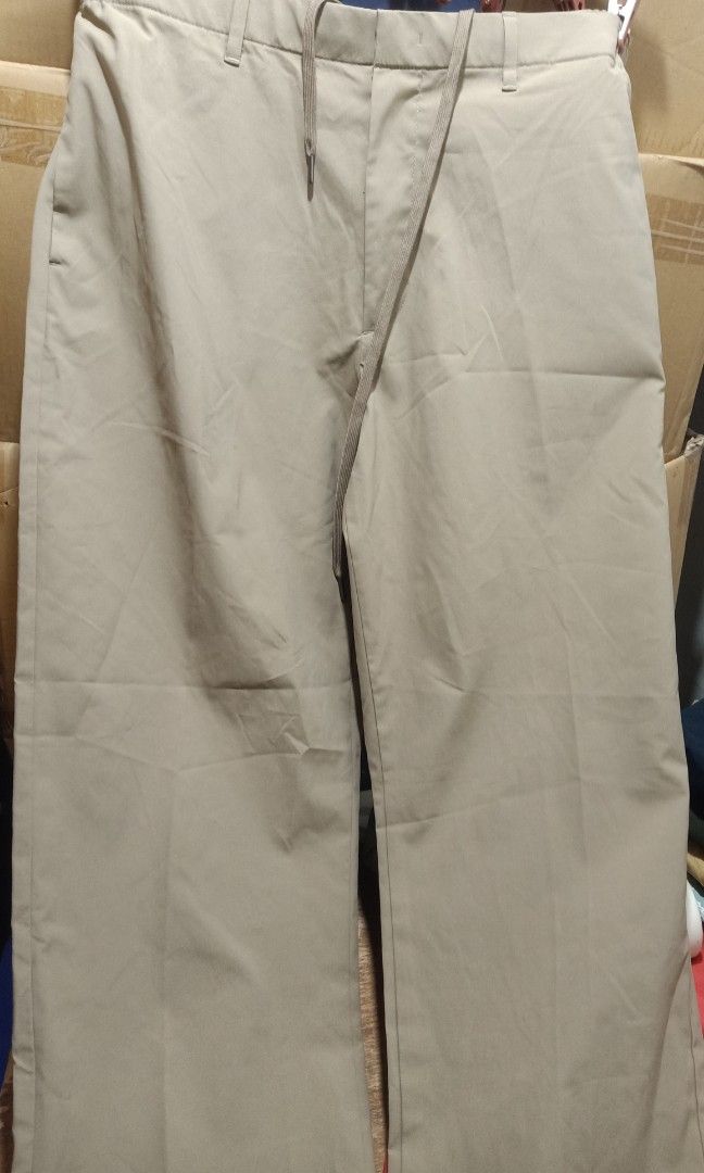 Uniqlo trousers (Category: Trousers) located in Pasig City. Submitted by urdal01 (Listing ID 1466598119, Image 2). Description: Brand: UNIQLO (in collaboration with Theory) Product Code / Style Number: 321-444609 Size: Men's Medium (M) — fits a waist size of roughly 76–84 cm Material: 100% Polyester (Ultra Light / AirSense fabric) Origin: Made in China length'40 waistline'34.