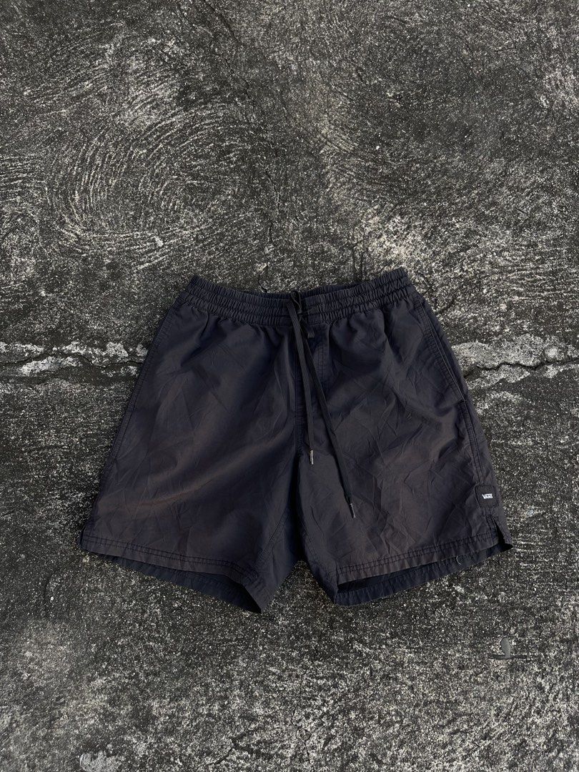 Vans Black Nylon Shorts Size Small (Category: Shorts) located in Tarlac. Submitted by supremo.0 (Listing ID 1466632824, Image 1). Description: - Brand: Vans - Color: Classic Black color rate 8.5/10 - Size: Small - Material: Durable nylon with breathable mesh lining - Fit: Elastic waistband with adjustable drawstring closure - Storage: Convenient side pockets + 1 secure zippered back pocket - Details: Iconic Vans logo patch near the hem - Origin: 
