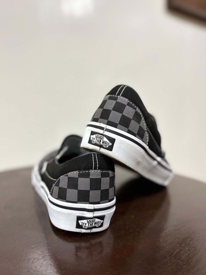 Vans Checkerboard Slip-On Black Grey (Category: Sneakers) located in Leyte. Submitted by katserafica (Listing ID 1466698226, Image 2). Description: - Brand: Vans - Style: Classic Slip-On (Black/Grey Checkerboard) - Size: US Men 7.5 / US Women 9.0 - Material: Durable canvas upper with elastic side accents - Sole: Signature waffle rubber outsole for reliable grip - Condition: Clean, with barely any wear on the soles.