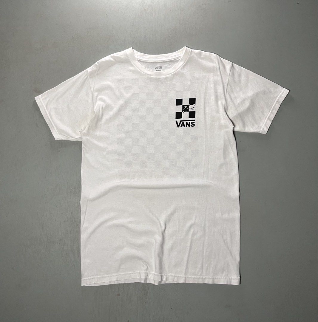 Vans White Shirt (Category: Activewear) located in Catbalogan. Submitted by yellfindss (Listing ID 1466745459, Image 1). Description: - Brand: Vans -19/28 - Color: White with black checkered cat graphic design - Size: Medium - Material: 100% cotton - Features: Small chest graphic and large statement graphic on the back - Condition: Well-maintained and ready to wear.