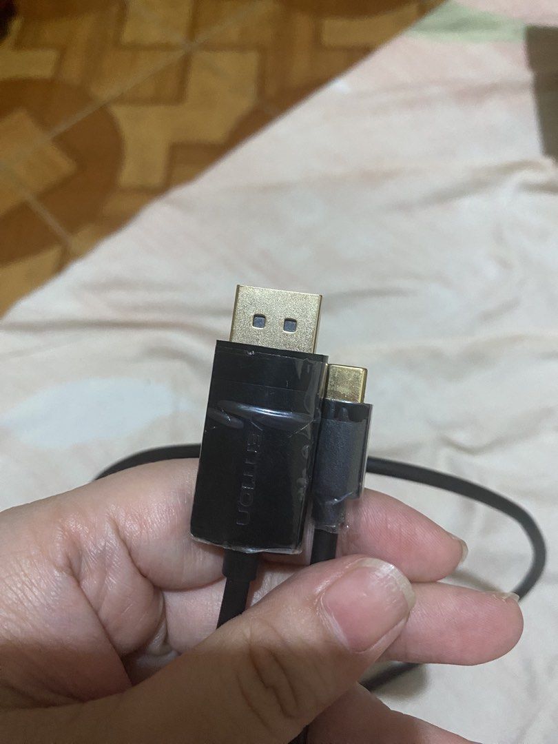 Vention DisplayPort to USB-C Bi-directional Cable (Category: Cables & Adaptors) located in Manila. Submitted by deesdeclutter (Listing ID 1466695742, Image 2). Description: - Brand: Vention - Type: USB-C to DisplayPort Cable - Color: Black with premium gold-plated connectors - Condition: Barely used, works perfectly (protective plastic film still on connector housing) - Compatibility: Connects laptops and phones directly to monitors.