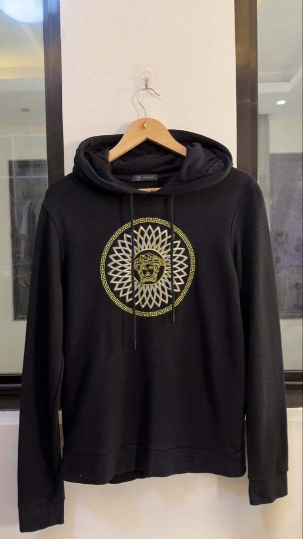 Versace Black Medusa Head Hoodie (Category: Coats, Jackets and Outerwear) located in Paranaque City. Submitted by preluxeshop_ph (Listing ID 1466766113, Image 2). Description: Versace Black Medusa Head Hoodie -Iconic Medusa Head Logo on Front -Condition: 9.8/10 -Dimes: Length: 26” Width: 21”.