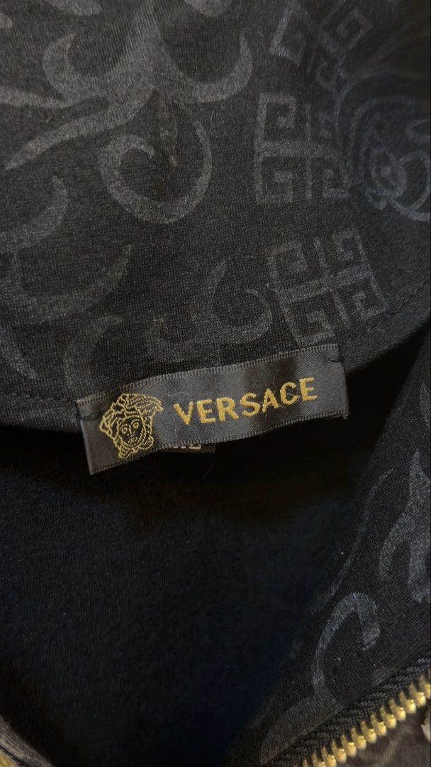 Versace Black Medusa Head Track Jacket (Category: Coats, Jackets and Outerwear) located in Paranaque City. Submitted by preluxeshop_ph (Listing ID 1466767894, Image 3). Description: Versace Black Medusa Head Track Jacket -Features iconic Medusa head logo -Signature Greek key pattern on sleeves and collar - Ideal for casual wear or making a statement -Condition: 9.8/10 -Dimes: Length: 23.5” Width: 21”.