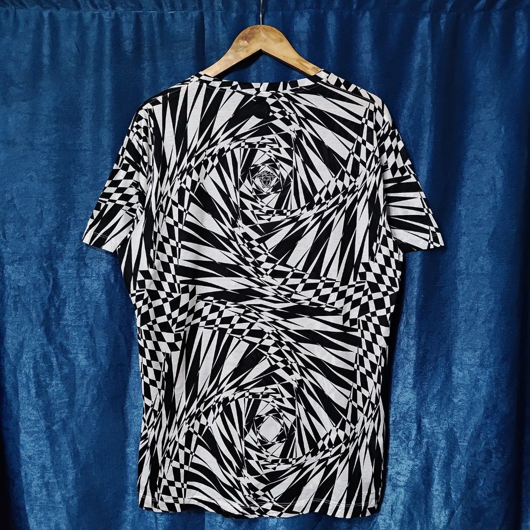 VERSACE ZEBRA PATTERN TOPS (Category: Shirts) located in Makati City. Submitted by upcycled.closeth (Listing ID 1466608622, Image 2). Description: - Authentic Versace product - Black & White, tee - Size: Large (women's) - Like new - Authentic - flaws: no flaws - Excellent condition - Need wash, fresh from bale - Features design of Versace zebra pattern tee - Material: 50% cotton & 50%nylon !!STILL NEGOTIABLE!!.