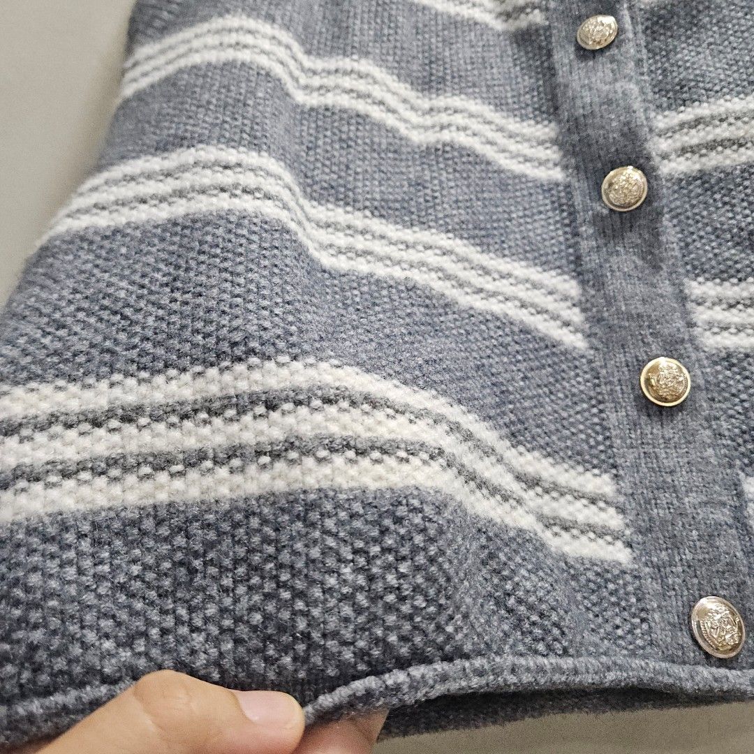 Vest type knitted sleeveless (Category: Sleeveless) located in Quezon City. Submitted by k_closetsale (Listing ID 1466773238, Image 2). Description: knitted vest type sleeveless functional buttons premium thick knit best fit up to 36bust or you can wear it unbottoned like vesr for 38bust above.