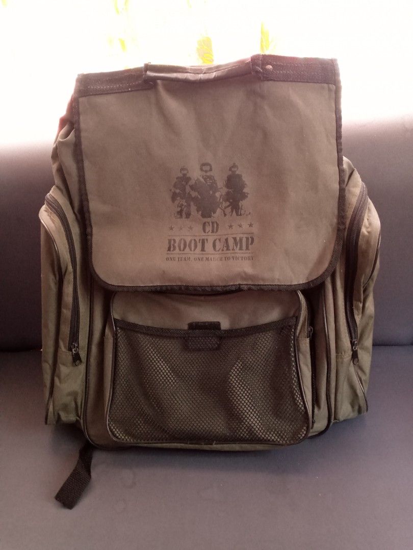 Vintage CD Boot Camp Green Backpack Army Style (Category: Backpacks) located in General Trias. Submitted by dwyane09 (Listing ID 1466631885, Image 3). Description: - Color/Style: Green canvas with military-style CD Boot Camp graphic - Storage: Spacious main compartment with lots of room - Pockets: Front mesh pocket please manage your expectation this is a vintage backpack good for collection also. .