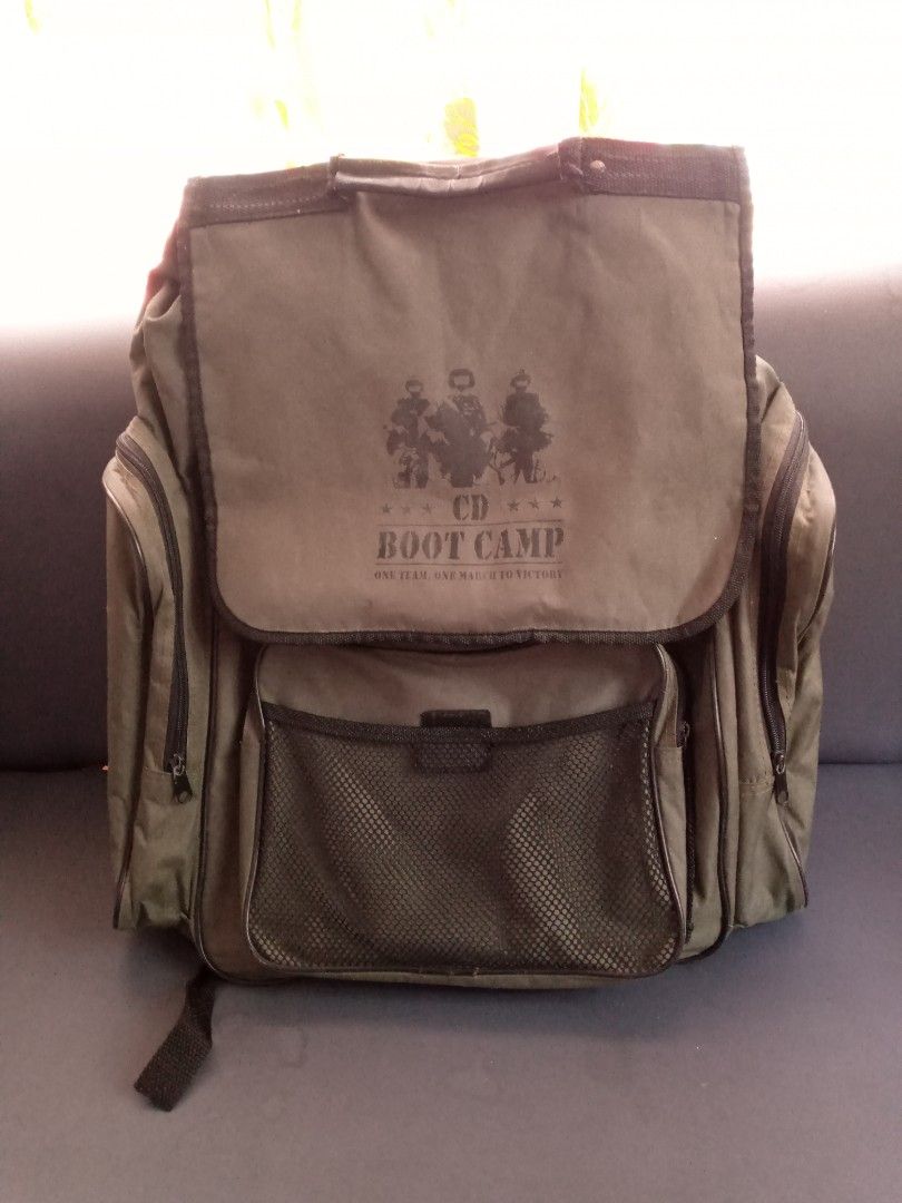 Vintage CD Boot Camp Green Backpack Army Style (Category: Backpacks) located in General Trias. Submitted by dwyane09 (Listing ID 1466631885, Image 1). Description: - Color/Style: Green canvas with military-style CD Boot Camp graphic - Storage: Spacious main compartment with lots of room - Pockets: Front mesh pocket please manage your expectation this is a vintage backpack good for collection also. .