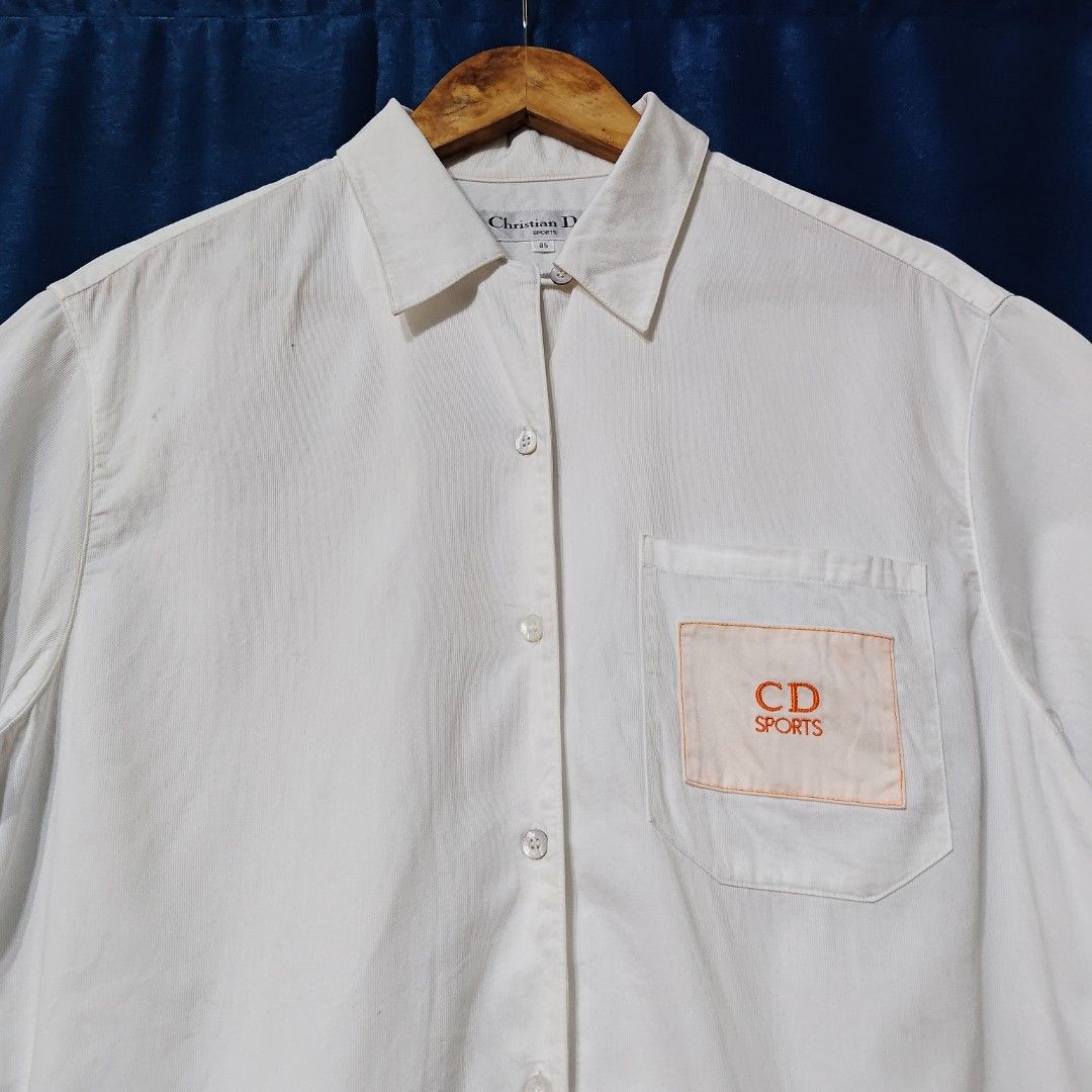 VINTAGE CHRISTIAN DIOR BUTTON DOWN POLO (Category: Tshirts & Polo Shirts ) located in Makati City. Submitted by upcycled.closeth (Listing ID 1466622041, Image 2). Description: - Authentic Vintage Christian Dior product - White / short sleeve button down - Size: Large (men's) - Like new - Authentic - flaws: no flaws - Excellent condition - Need wash, fresh from bale - Features design of Christian Dior button down polo with side pocket logo - Mater
