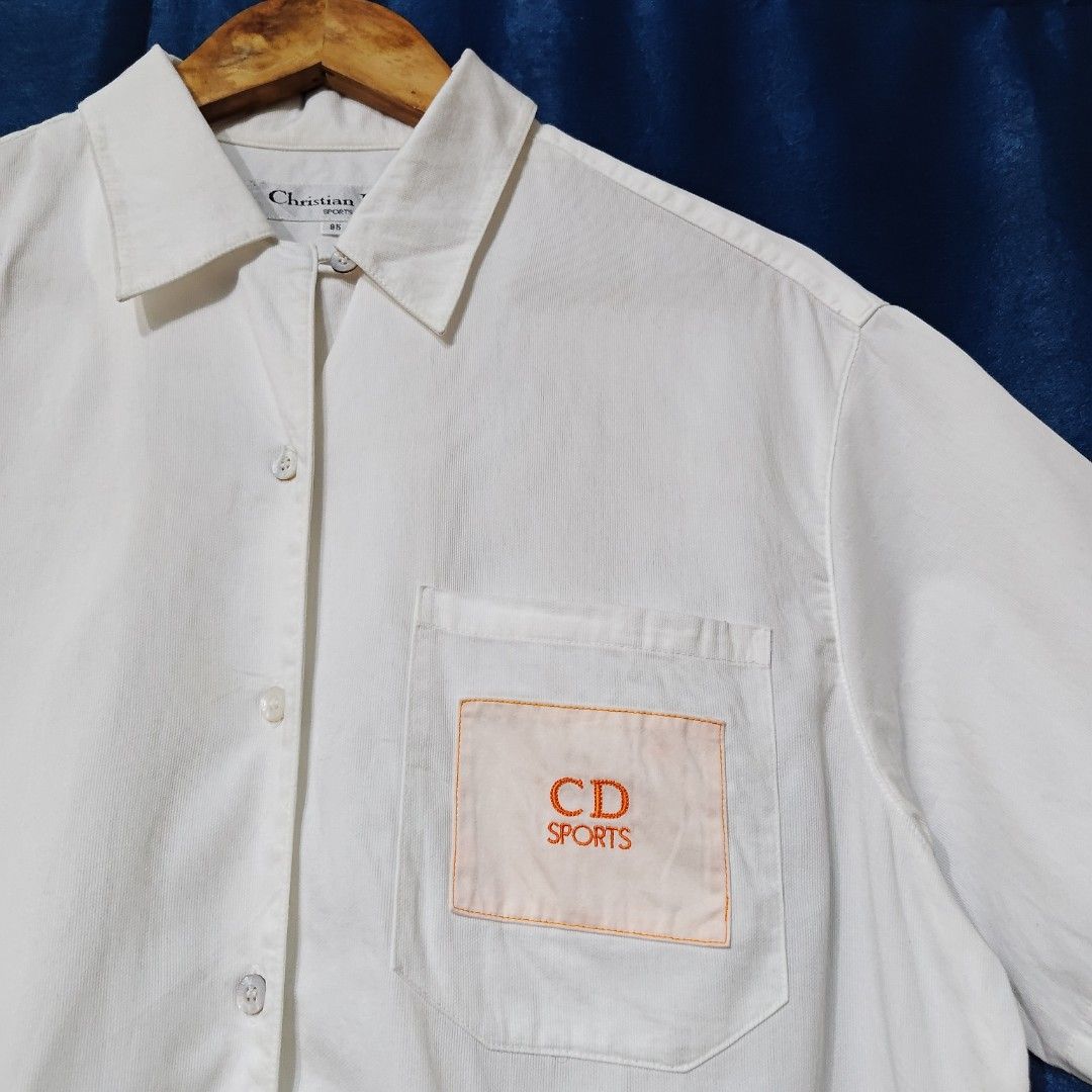 VINTAGE CHRISTIAN DIOR BUTTON DOWN POLO (Category: Tshirts & Polo Shirts ) located in Makati City. Submitted by upcycled.closeth (Listing ID 1466622041, Image 3). Description: - Authentic Vintage Christian Dior product - White / short sleeve button down - Size: Large (men's) - Like new - Authentic - flaws: no flaws - Excellent condition - Need wash, fresh from bale - Features design of Christian Dior button down polo with side pocket logo - Mater