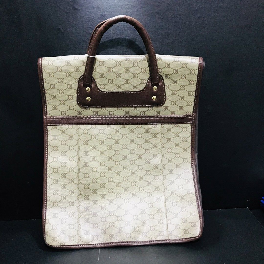 Vintage Monogram Tote Bag Brown Cream (Category: Tote Bags) located in Baao. Submitted by all.things.japan (Listing ID 1466707344, Image 1). Description: 14.0 x 17.0 x 6.5 inches - Stylish cream and brown geometric monogram tote bag - Durable brown faux leather top handles with gold-tone hardware - Expandable bottom zip for extra storage capacity - Fully lined grey interior with multiple compartments and zipped pockets - Secure zip closure - Cond