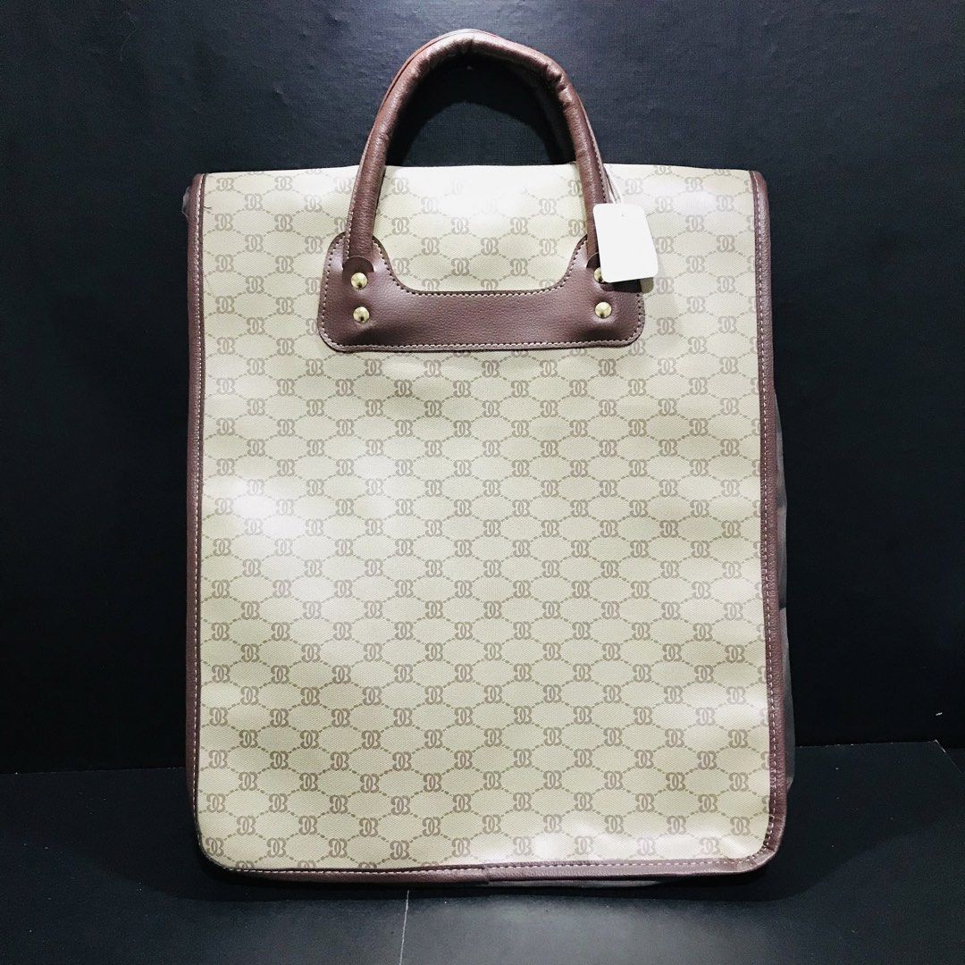 Vintage Monogram Tote Bag Brown Cream (Category: Tote Bags) located in Baao. Submitted by all.things.japan (Listing ID 1466707344, Image 2). Description: 14.0 x 17.0 x 6.5 inches - Stylish cream and brown geometric monogram tote bag - Durable brown faux leather top handles with gold-tone hardware - Expandable bottom zip for extra storage capacity - Fully lined grey interior with multiple compartments and zipped pockets - Secure zip closure - Cond