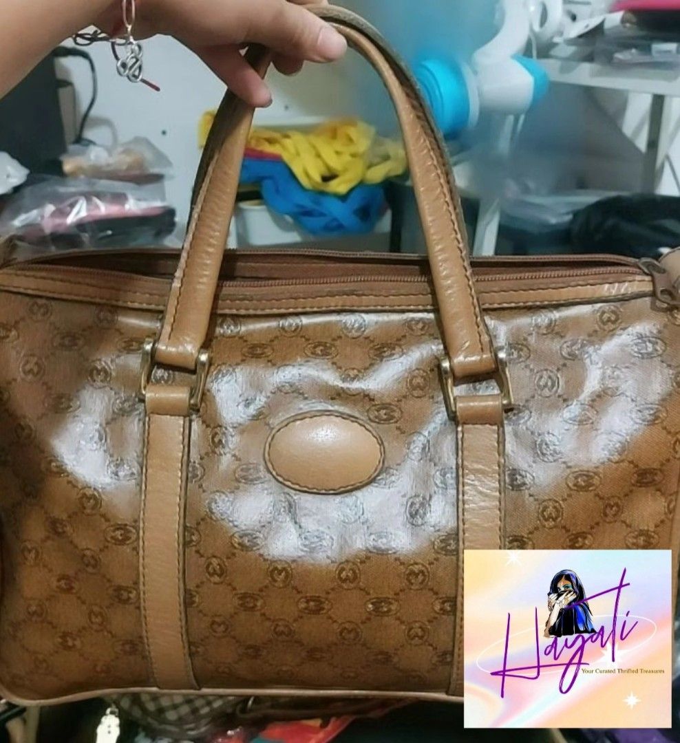 Vintage Morabito Monogram Duffle Bag (Category: Luxury Bags & Wallets) located in Angono. Submitted by just.call.me_lazy (Listing ID 1466772131, Image 1). Description: 🤎✨ Vintage Morabito Duffle Bag ✨🤎 A timeless vintage piece featuring Morabito's signature monogram canvas, complemented by rich tan leather trim and a classic duffle silhouette. ✨ Signature Morabito monogram ✨ Leather handles and accents ✨ Spacious interior ✨ Ideal for travel, wo