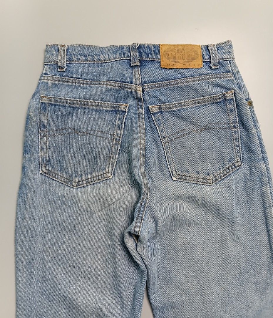 Vintage No Limits light-wash denim jeans. (Category: Jeans) located in Manila. Submitted by hustler_777 (Listing ID 1466675507, Image 3). Description: Design Features Silhouette: They feature a classic high-rise, straight-leg cut typical of vintage 1980s or 1990s styling. Front Pockets: Standard curved scoop pockets with a small coin/watch pocket on the right side. Fly & Waist: A traditional zip fly with a single metal button closure at the waist