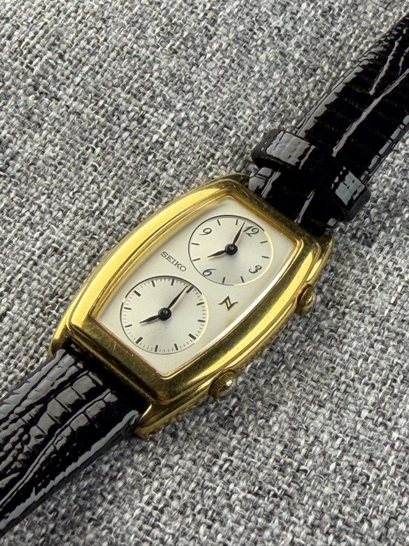 Vintage Seiko Noei Dual Time (Category: Women's Watches) located in Bacoor. Submitted by offtheclock (Listing ID 1466637708, Image 2). Description: Vintage Seiko Noei Dual Time Condition: Pre-owned Reference No: 1E20-3A00 Movement: Quartz (1E20) Material: Stainless Steel Gold-Plated Finish Case Diameter: 21x34mm (Hardlex Mineral Crystal) Dial: White / Light Silver Finish Strap: Brandnew Aftermarket Black Leather Strap Inclusion: Replacement Box P