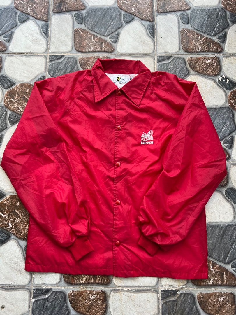 Vintage TISCO Red Nylon Coach Jacket Windbreaker (Category: Coats, Jackets and Outerwear) located in Caloocan City. Submitted by sillapwet0606 (Listing ID 1466569358, Image 1). Description: - Color: Vibrant red - Material: Lightweight nylon outer layer - Features: Pointed collar, snap-button front closure, and ribbed sleeve cuffs - Branding: White embroidered TISCO tractor logo on the chest - Versatility: Perfect casual outerwear to throw over a 