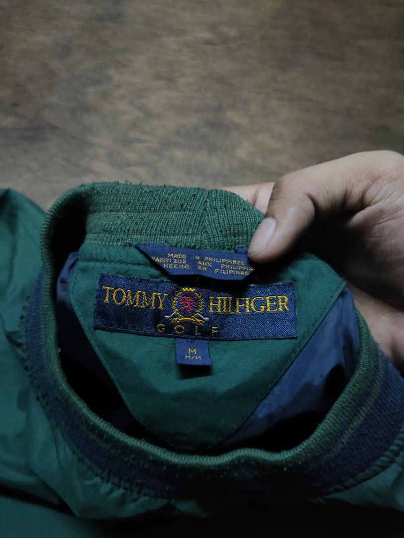Vintage Tommy Hilfiger Pullover Windbreaker Golf Jacket (Category: Coats, Jackets and Outerwear) located in Manila. Submitted by montillano25396 (Listing ID 1466670987, Image 2). Description: Vintage Tommy Hilfiger Pullover Windbreaker Jacket Dimes: 23 x 26 (L) Good Condition♥️ minimal lints only on neck.