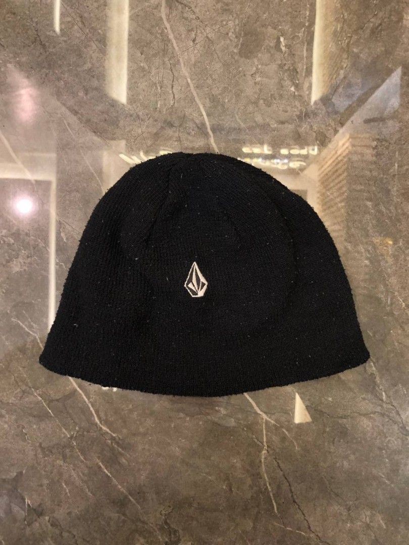 Volcom Black Beanie (Category: Caps & Hats) located in Santa Cruz. Submitted by remsonnnc (Listing ID 1466624440, Image 1). Description: - Brand: Volcom - Color: Black with white embroidered stone logo - Material: Warm, cozy knit fabric - Features: Genuine interior tags included - Style: Versatile, minimalist design that pairs well with any winter or cold-weather outfit - Condition: Brand new / Well-maintained Width: 9 Length: 7 Issue: minor lint