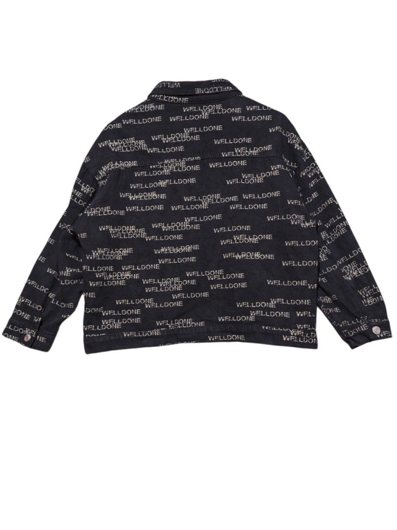 We11done All-Over Print Black Denim Jacket (Category: Coats, Jackets and Outerwear) located in Maasim. Submitted by ukayganda25 (Listing ID 1466688760, Image 2). Description: - Brand: We11done - Color: Black with all-over white text print - Fit: Oversized fit through arms and torso - Material: Heavyweight denim that holds its shape well -23*23 dimensions - Features: Button-up front, matching metal buttons, classic collar, two chest pockets, and t