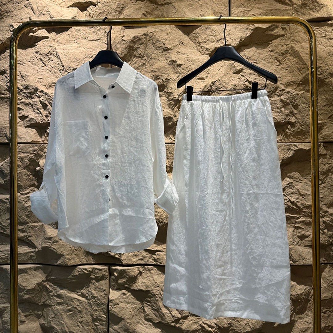 White Button Up Shirt and Skirt Set (Category: Sets or Coordinates) located in Taguig. Submitted by mengxir20193848 (Listing ID 1466678861, Image 1). Description: - Style: Matching white two-piece set (long-sleeve button-up shirt & midi skirt) - Details: Contrast black buttons, chest pocket, and an adjustable elastic drawstring waistband - Material: Lightweight and breathable, ideal for sunny days - Condition: Worn only once, super clean and like