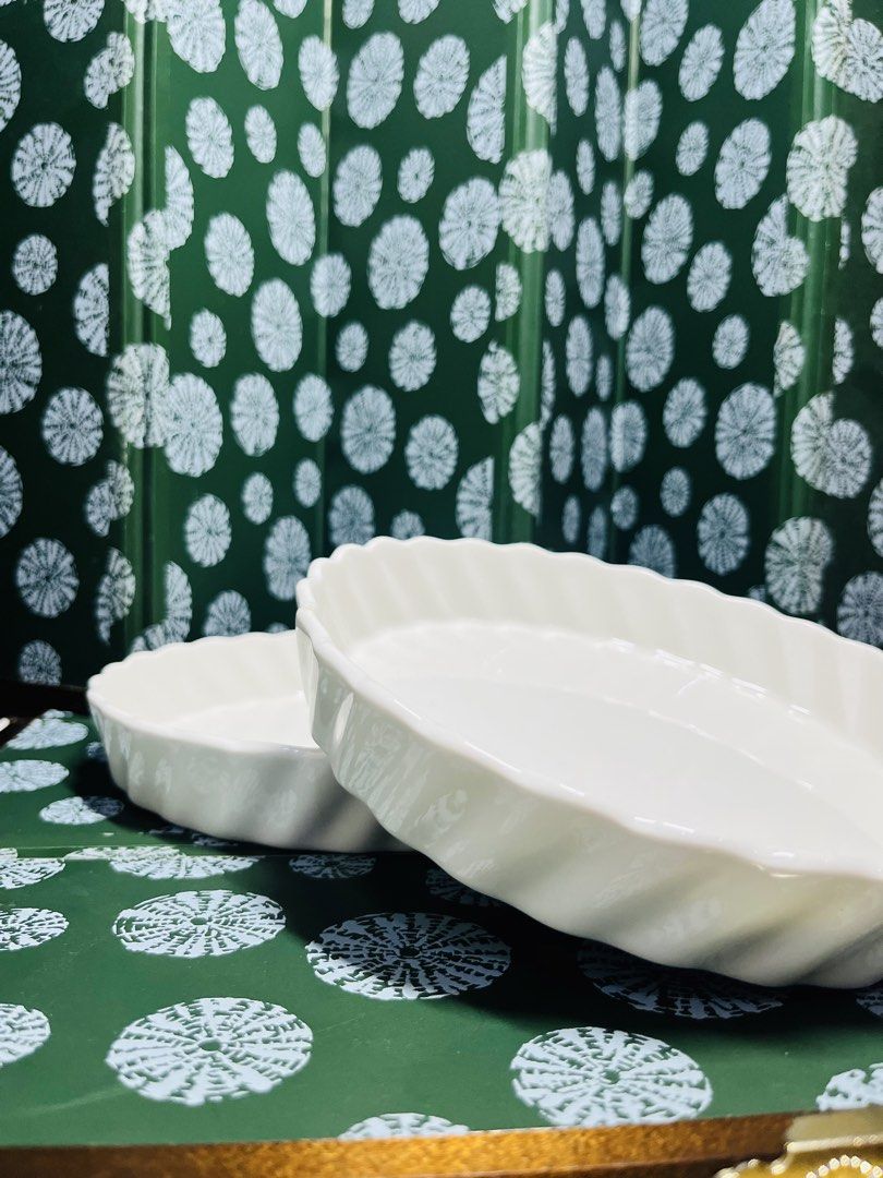White ceramic ruffled pie dish baking pan (Category: Bakeware) located in Malabon City. Submitted by mgsurplus (Listing ID 1466565628, Image 2). Description: - Set of 2 white ceramic tart pans - Classic round shape with elegant fluted edges - Dimensions: ~7 inches diameter, ~2 inches depth - Durable build with a smooth, glossy glazed finish - Ideal for baking quiches, tarts, and homemade pies - Clean bottoms featuring standard kiln marks.