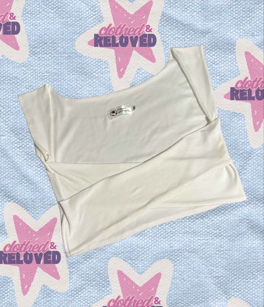 White Criss-cross Crop Top (Category: Sleeveless) located in Binan City. Submitted by szummie (Listing ID 1466620398, Image 1). Description: - Brand: Fhilar Apparel - Style: Sleeveless crop top with a unique front wrap-around crossover design and wide scoop neckline - Material: Soft and comfortable stretch fabric - Fit/Pairing: Great for styling with high-waisted jeans or skirts - Condition: Clean, well-maintained.