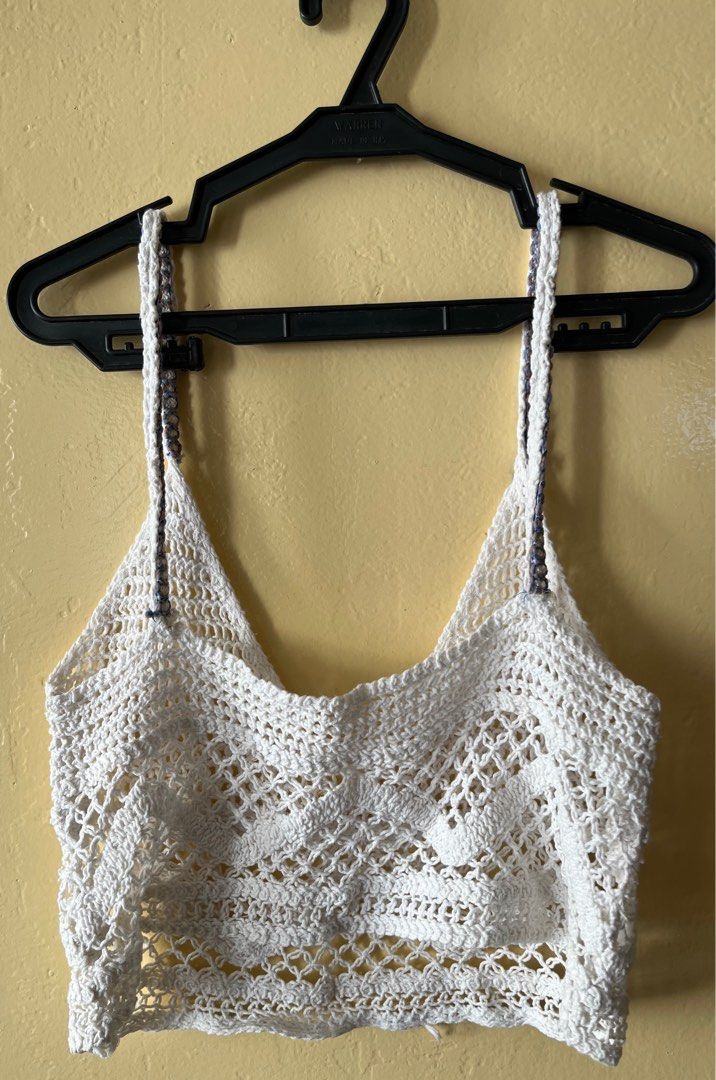 White Crochet Top Small (Category: Blouses) located in Cebu City. Submitted by purgemycloset (Listing ID 1466636961, Image 2). Description: - Size: Small - Color: White with blue and white braid detail - Material: Lightweight, breathable handmade crochet knit - Design: V-neckline, adjustable spaghetti straps, open-weave chevron pattern - Condition: Brand new / Excellent - Perfect for: Warm weather, beach cover-ups, and layering.