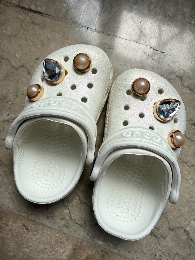 White Crocs Classic Clogs with Pearl and Crystal Charms (Category: Babies & Kids Fashion) located in Malasiqui. Submitted by happymomma26 (Listing ID 1466566266, Image 2). Description: Can fit from new born to 1 year old.