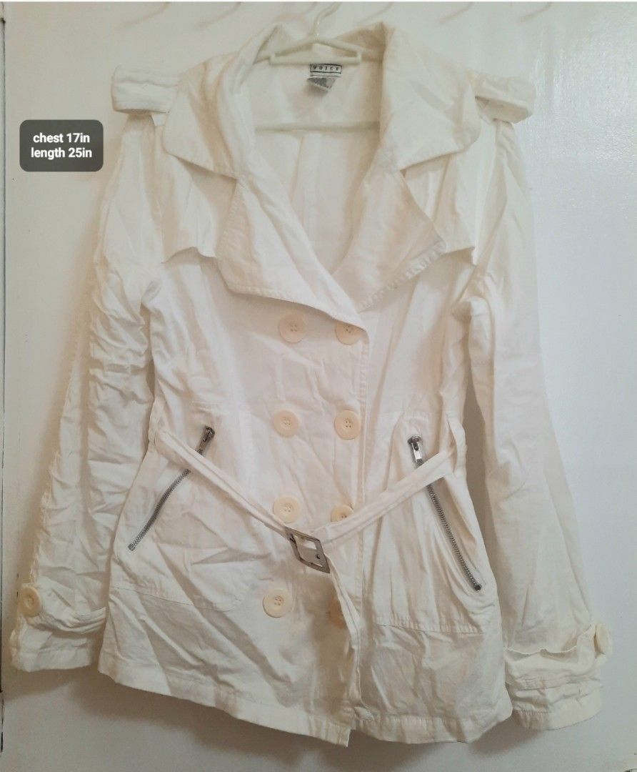 White Double-Breasted Trench Coat / Jacket with Belt (Category: Coats, Jackets and Outerwear) located in Quezon City. Submitted by dannikkishoppe2 (Listing ID 1466613871, Image 2). Description: White Double-Breasted Trench Coat / Jacket with Belt ‼️₱280‼️ • Style: Double-breasted front with buttons, lapel collar, belted waist with buckle, and zippered pocket details • Measurements: ◦ Chest: 17 inches (flat lay, armpit to armpit) ◦ Length: 25 inch