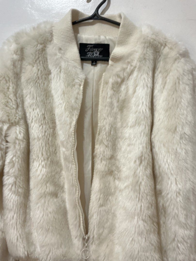 White Faux Fur Bomber Jacket (Category: Coats, Jackets and Outerwear) located in San Pedro. Submitted by itsannabg (Listing ID 1466612751, Image 3). Description: - Style: Fluffy faux fur bomber jacket - Color: White - Size: Small - Features: Ribbed knit collar, cuffs, and hem, full zip closure with round zipper pull, fully lined interior Good fit for XS to S.