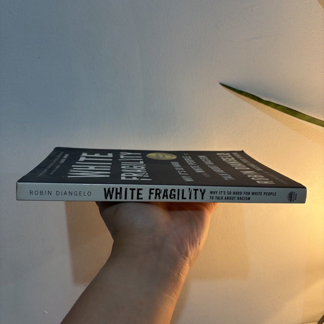 White Fragility by Robin DiAngelo (Category: Storybooks) located in Manila. Submitted by ajdeclutter (Listing ID 1466591317, Image 2). Description: - Title: White Fragility by Robin DiAngelo - Publisher: Beacon Press - Format: Paperback - Condition: Clean pages with minor shelf wear on the cover - Topic: Explores systemic racism, difficult conversations about race, and societal change .