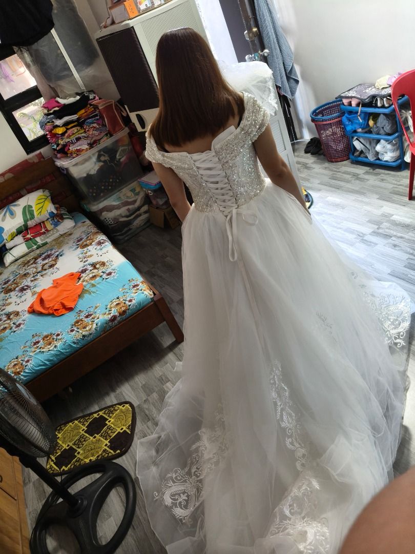 White Off-Shoulder Wedding Gown with Sequins and Train (Category: Evening dresses & gowns) located in Santa. Submitted by pink18w3ar (Listing ID 1466565507, Image 2). Description: - Style: Off-shoulder wedding gown - Bodice: Heavily beaded with sparkly sequins - Skirt: Tulle with intricate lace embroidery on the center front and long train - Back: Lace-up corset with satin ribbon closure - Condition: Worn once, professionally cleaned - Ideal for:
