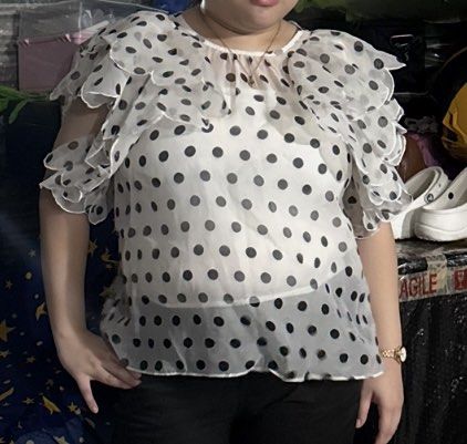 White Polka Dot Ruffle Sleeve Blouse (Category: Blouses) located in Mandaluyong City. Submitted by _pinklover (Listing ID 1466587097, Image 1). Description: - brought from gh - worn for fitting lang - no inner - for reference person on pic (bust 36c, waist 34-35) actually plus size na.
