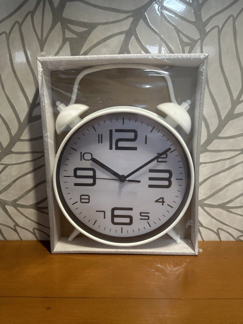 White Twin Bell Analog Alarm Clock in Box (Category: Clocks) located in Makati City. Submitted by twodoxies (Listing ID 1466651832, Image 1). Description: - Brand: Twin Bell Analog Alarm Clock - Color: Classic White - Display: White dial with large, easy-to-read bold black numerals and hour markers -needs battery.