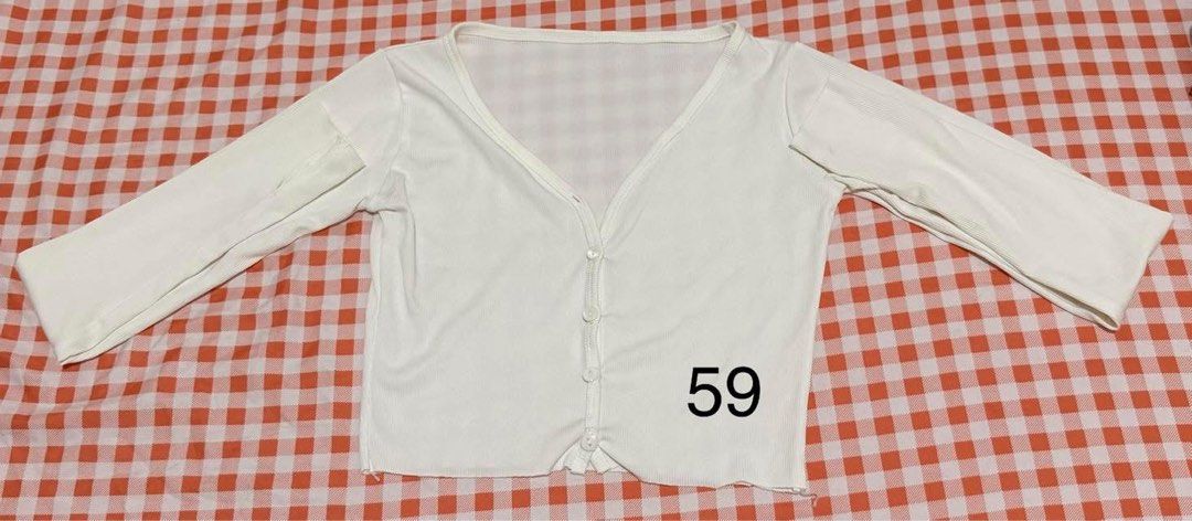 White V-neck Cropped Cardigan with Buttons (Category: Longsleeves) located in Quezon City. Submitted by itsmesummeeer (Listing ID 1466708826, Image 1). Description: - Style: White ribbed long-sleeve cropped cardigan - Neckline: V-neck with a row of small front buttons - Material: Stretchy, soft knit for a comfortable everyday fit - Fit: Waist-length.