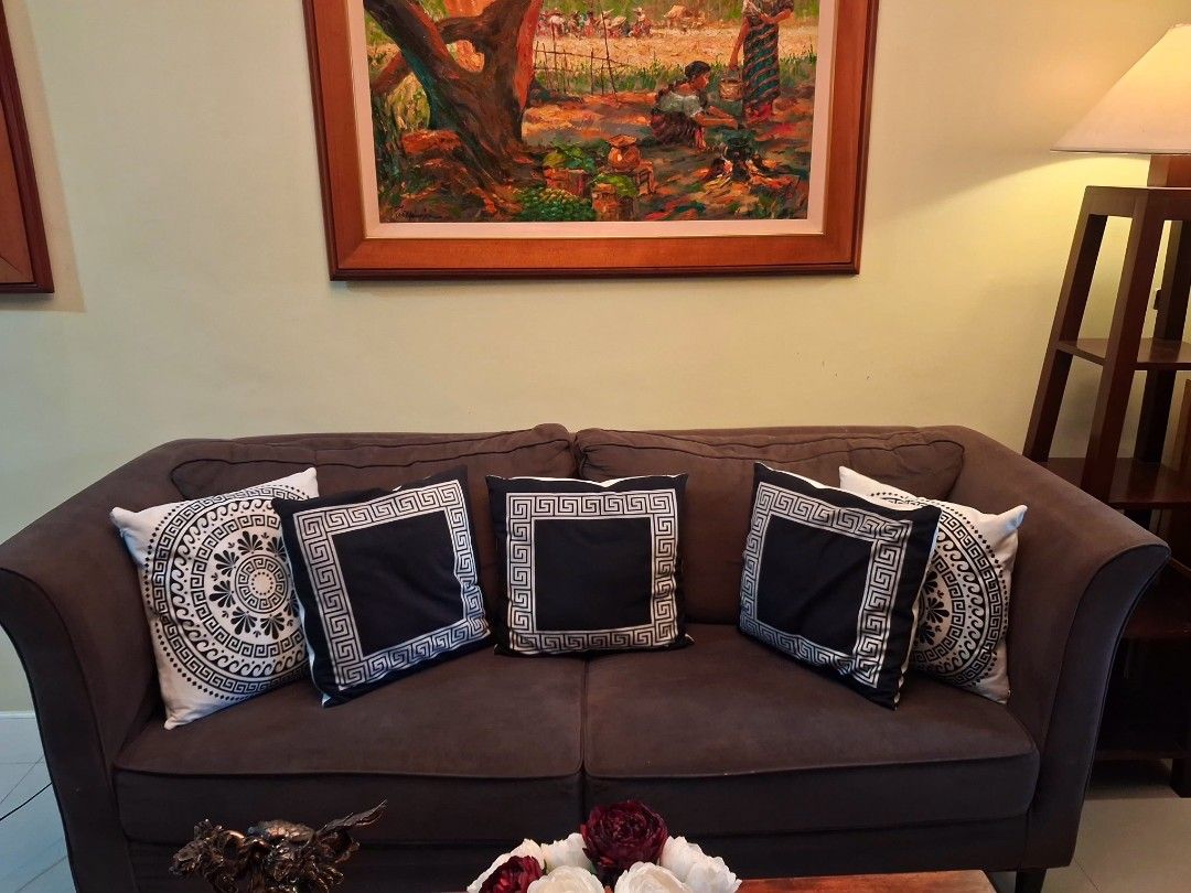 Wooden Coffee Table with Rectangular Top and Sturdy Legs (Category: Tables & Sets) located in Manila. Submitted by msbfheuw5 (Listing ID 1466610170, Image 2). Description: - Type: Rectangular wooden coffee table - Finish: Natural wood grain with dark brown legs - Condition: Minor scratches and scuffs from daily use; solid and sturdy frame - Features: Spacious tabletop for books, trays, and vases - Placement: Ideal for any living room setup - sofa