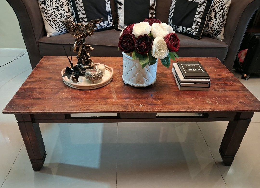 Wooden Coffee Table with Rectangular Top and Sturdy Legs (Category: Tables & Sets) located in Manila. Submitted by msbfheuw5 (Listing ID 1466610170, Image 3). Description: - Type: Rectangular wooden coffee table - Finish: Natural wood grain with dark brown legs - Condition: Minor scratches and scuffs from daily use; solid and sturdy frame - Features: Spacious tabletop for books, trays, and vases - Placement: Ideal for any living room setup - sofa