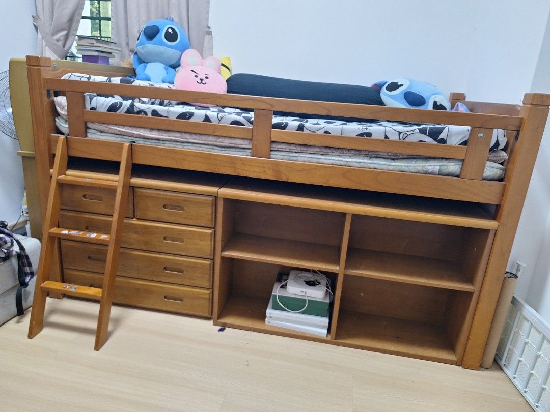 Solid Wood Bed Frame with Bookshelf and Ladder (Category: Bed Frames & Mattresses) located in Manila. Submitted by farmgirl2026 (Listing ID 1466655176, Image 1). Description: - From Japan - Material & Color: Sturdy wooden loft bed finished in a warm brown tone - Includes: Matching open bookshelf unit placed in front - Safety Features: Built-in ladder on the left side and safety rails on the top bunk - Space-Saving: Generous open space underneath 